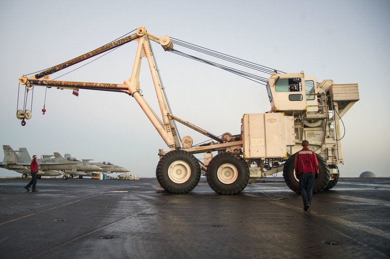 U.S. Sailors assigned to the crash and salvage team aboard the aircraft carrier USS Harry S. Truman (CVN 75) move the ship's mobile salvage crane on the flight deck March 9, 2014, in the Gulf of Oman 140309-N-GH675-002 - U.S._Sailors_assigned_to_the_crash_and_salvage_team_aboard_the_aircraft_carrier_USS_Harry_S._Truman_(CVN_75)_move_the_ship's_mobile_salvage_crane_on_the_flight_deck_March_9,_2014,_in_the_Gulf_of_Oman_140309-N-GH675-002.jpg U.S._Sailors_assigned_to_the_crash_and_salvage_team_aboard_the_aircraft_carrier_USS_Harry_S._Truman_(CVN_75)_move_the_ship's_mobile_salvage_crane_on_the_flight_deck_March_9,_2014,_in_the_Gulf_of_Oman_140309-N-GH675-002.jpg